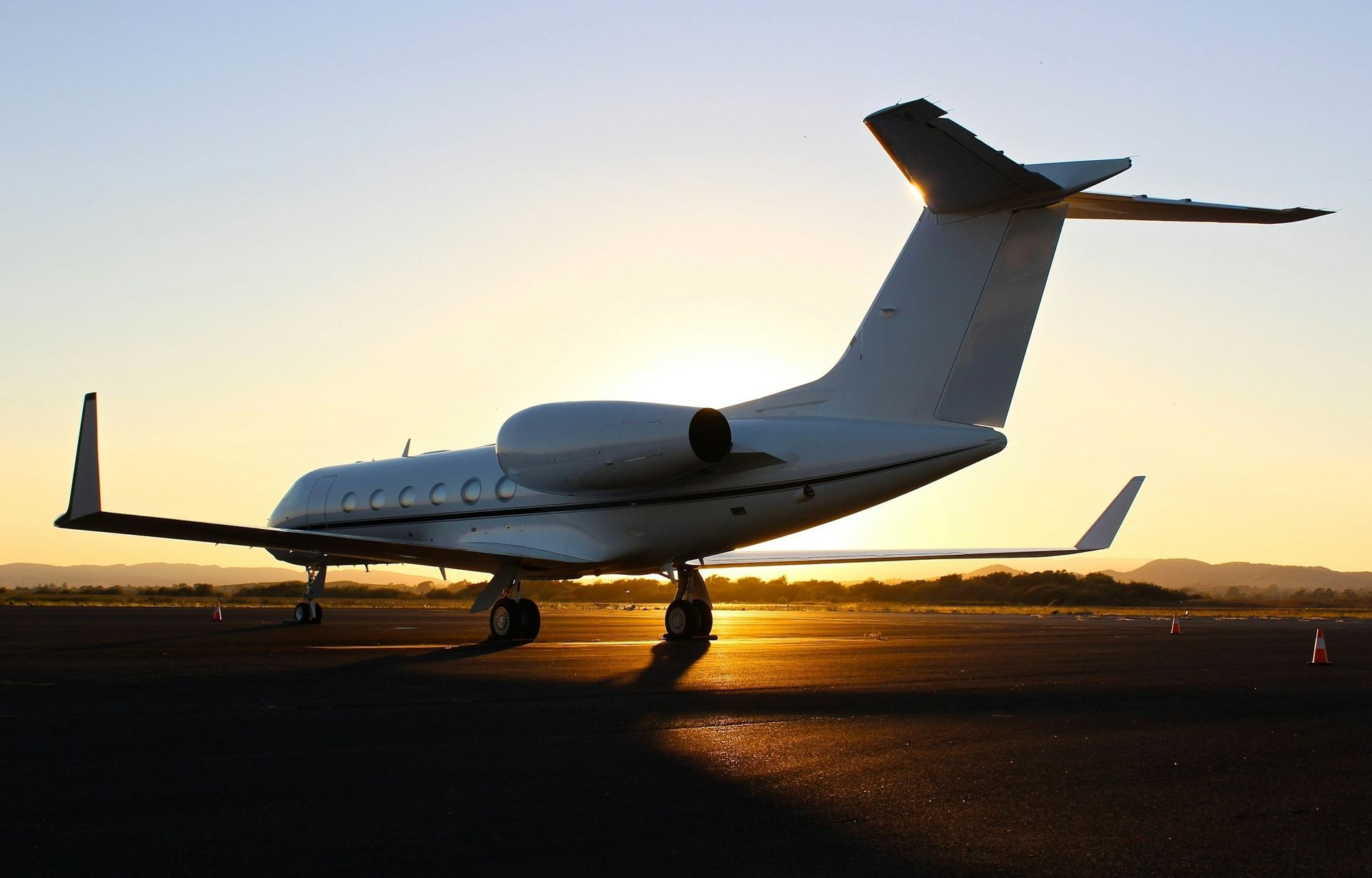 Business jet on the ramp at golden hour
