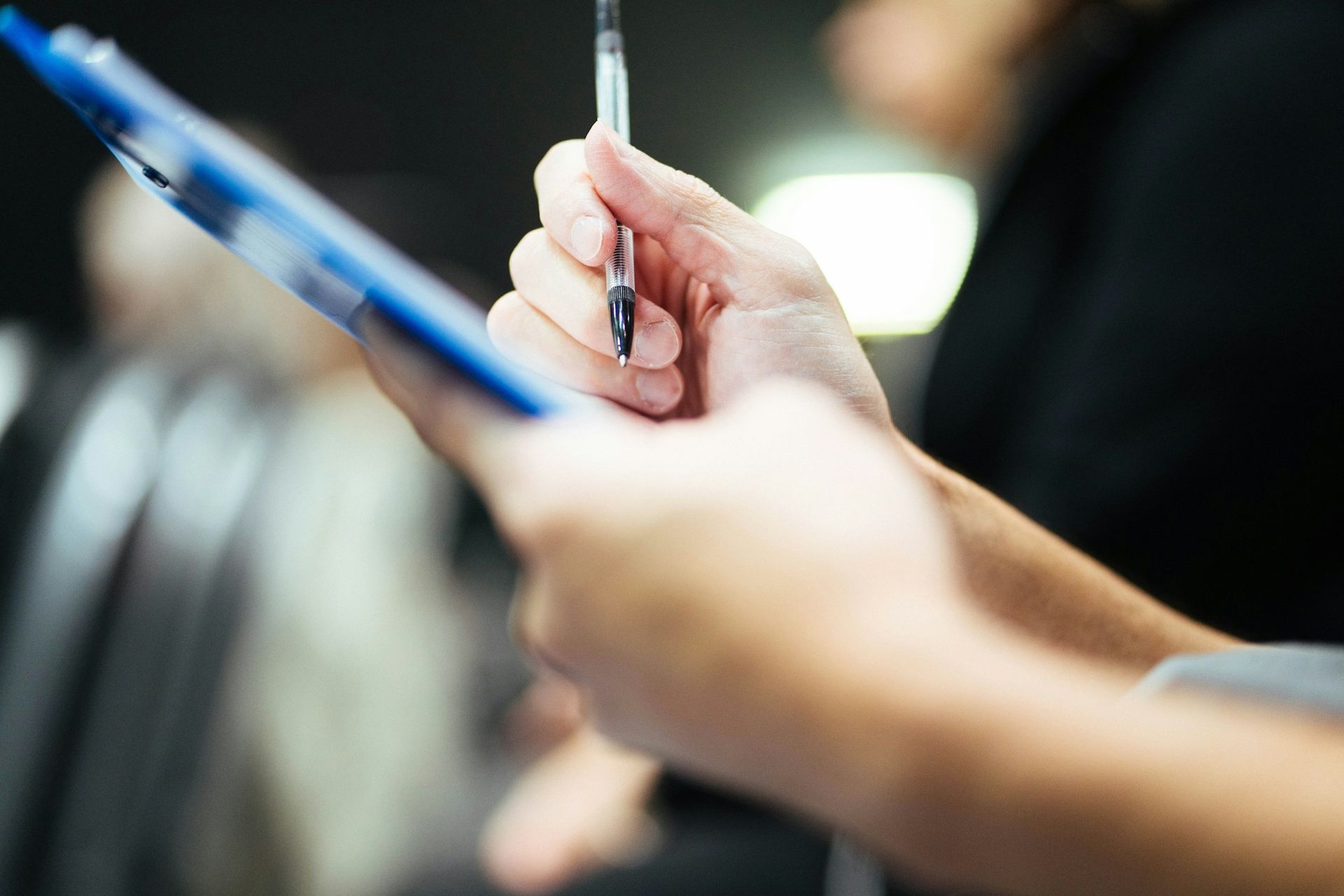 Signing a fuel ticket on a clipboard
